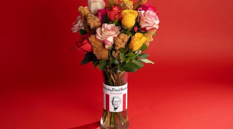 A suggestion marketed this year by Kentucky Fried Chicken. They’re calling it a “buckquet,” and it consists of a glass vase containing a dozen roses along with eight wooden skewers on which the Colonel’s tenders can be impaled.