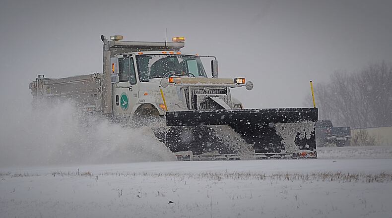 ODOT trucks plowing and salting Interstate 675 in Greene County  Feb. 15, 2021. MARSHALL GORBY/STAFF