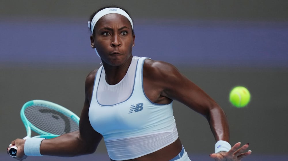FILE - Coco Gauff of the United States plays a forehand to Belinda Bencic of Switzerland during a women's singles match of the China Open tennis tournament, in Beijing, on Sept. 30, 2025. (AP Photo/Mahesh Kumar A., File)