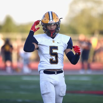 Springfield's Aaron Scott plays against Trotwood-Madison on Friday, Sept. 1, 2023, in Trotwood. David Jablonski/Staff