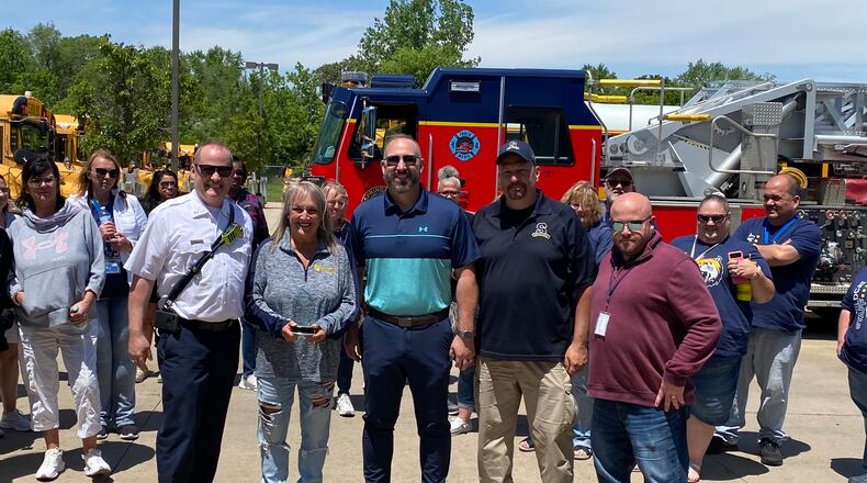 Pictured from left are Springfield Fire Rescue Division Assistant Chief Matt Smith, Springfield City Schools bus driver Kim Skabla, Superintendent Bob Hill,  Business Manager of Operations, Safety & Security Dave Lyle and Transportation Supervisor Ryan Brookins. Skabla received recognition for stopping to put out a porch fire she saw while on her route. CONTRIBUTED