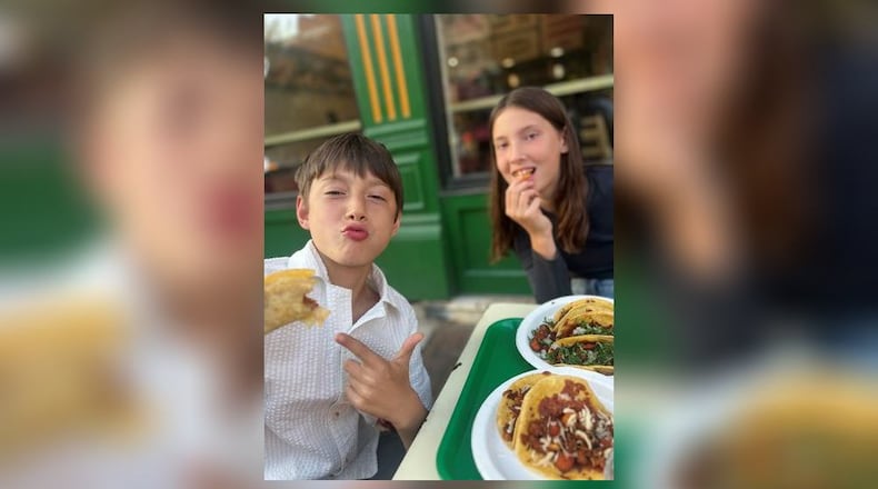 Whitney Kling's twins enjoy some lunch. CONTRIBUTED