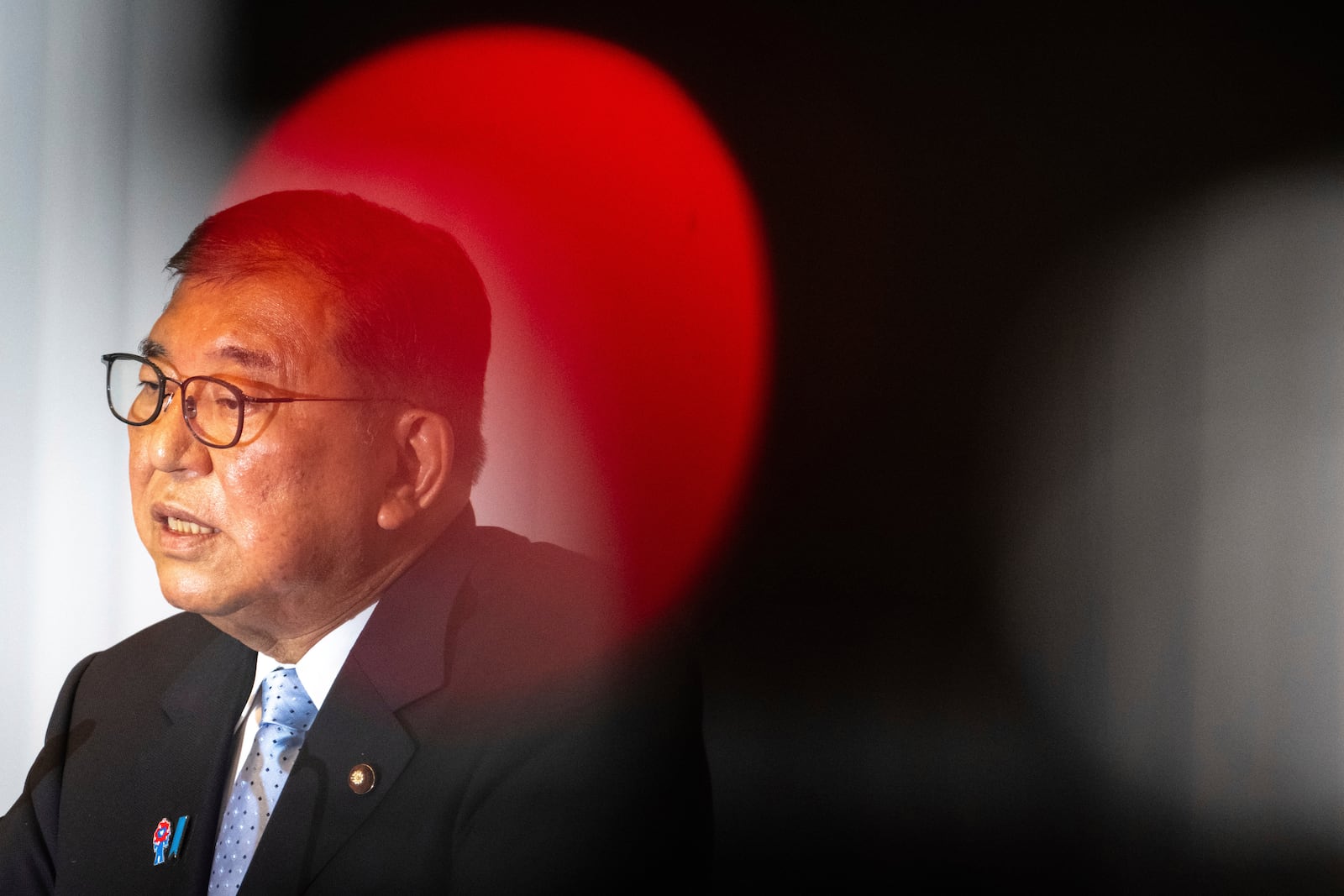 Japan's Prime Minister Shigeru Ishiba attends a press conference at the headquarters of the Liberal Democratic Party (LDP) in Tokyo Monday, July 21, 2025 after the prime minister's ruling coalition failed to secure a majority in the upper house in a parliamentary election. (Philip Fong/Pool Photo via AP)