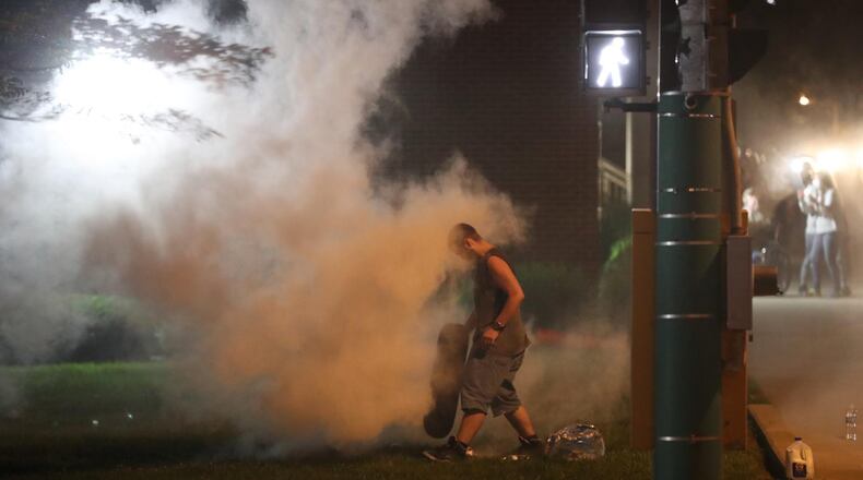 Springfield police used tear gas to disperse a crowd gathered near the Clark County Common Pleas Courthouse on Sunday night, May 31, 2020. The crowd remained from an afternoon march in protest following the death of George Floyd last week in Minnesota. BILL LACKEY / STAFF