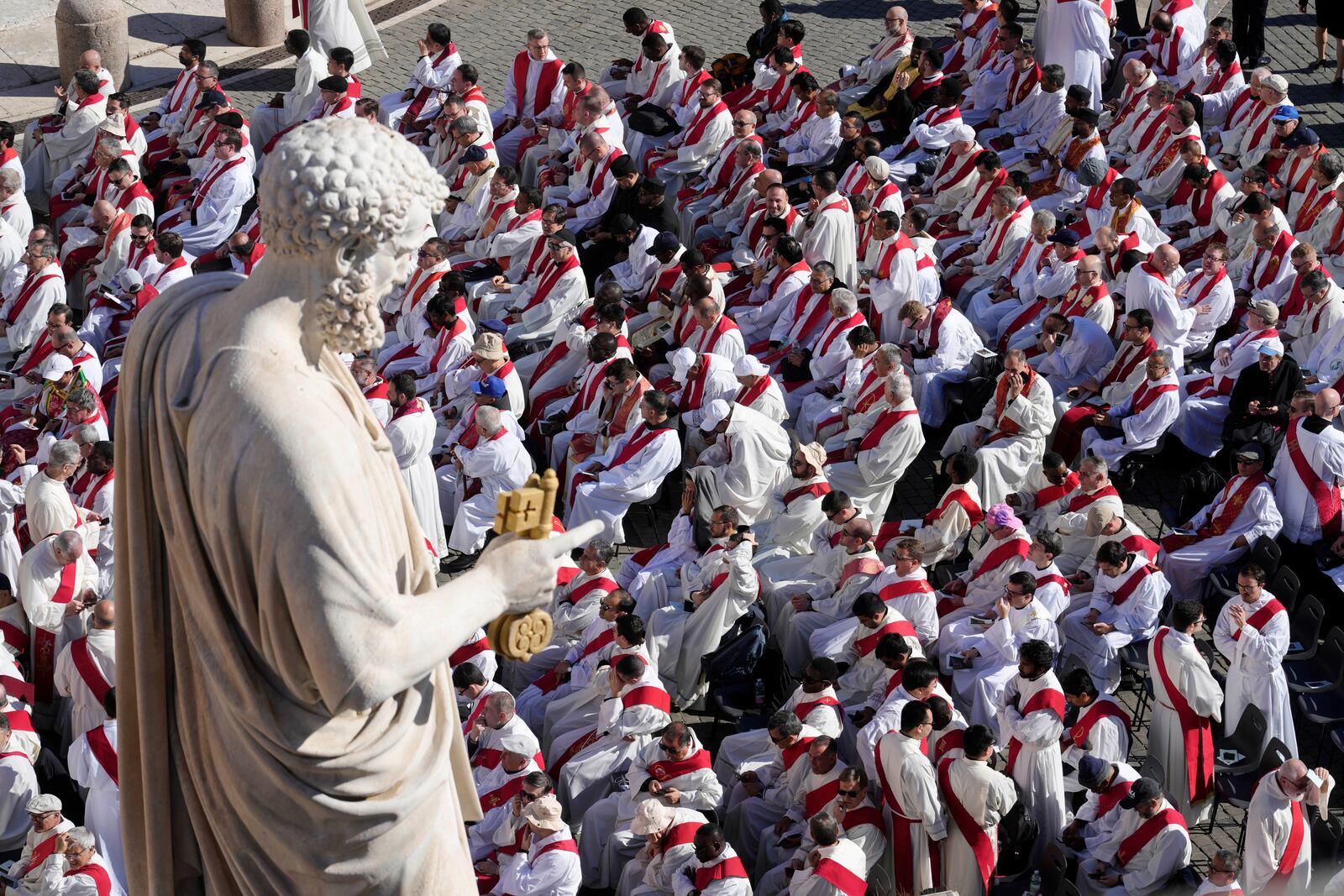 Clergy take their seats for the funeral of Pope Francis in St. Peter's Square at the Vatican, Saturday, April 26, 2025. (AP Photo/Markus Schreiber)