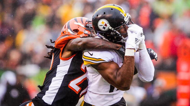 Cincinnati Bengals cornerback Dre Kirkpatrick interupts a pass intended for Pittsburgh Steelers wide receiver JuJu Smith-Schuster during their game Sunday, Oct. 14 at Paul Brown Stadium in Cincinnati. The Steelers won 28-21. NICK GRAHAM/STAFF