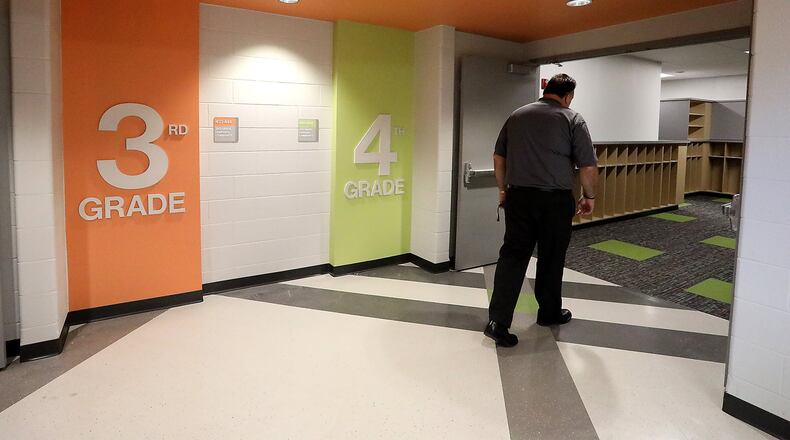 Urbana City Schools Superintendent Charles Thiel says the district is working on their finalized plan for the fall reopening. This is him walking into the 4th Grade Unit at the new Urbana Elementary and Junior High School a little over a year ago. BILL LACKEY/STAFF