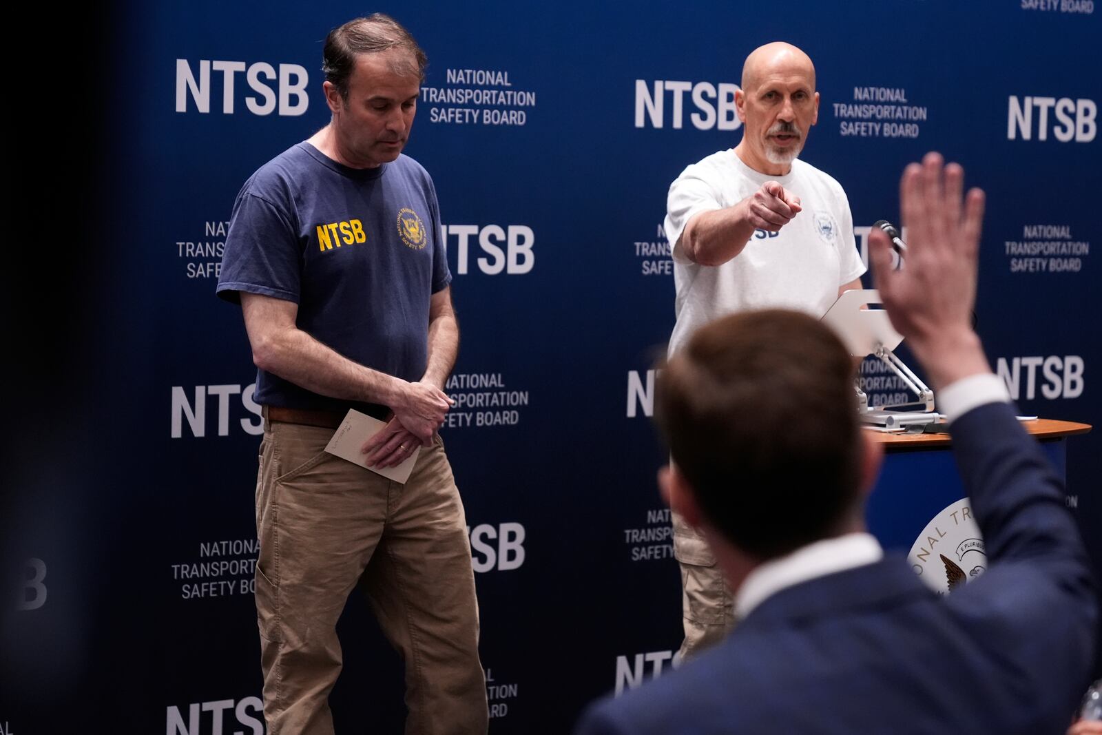 National Transportation Safety Board lead investigator Brian Young, left, and board member Michael Graham take questions from reporters during a news conference in New York, Monday, May 19, 2025. (AP Photo/Seth Wenig)