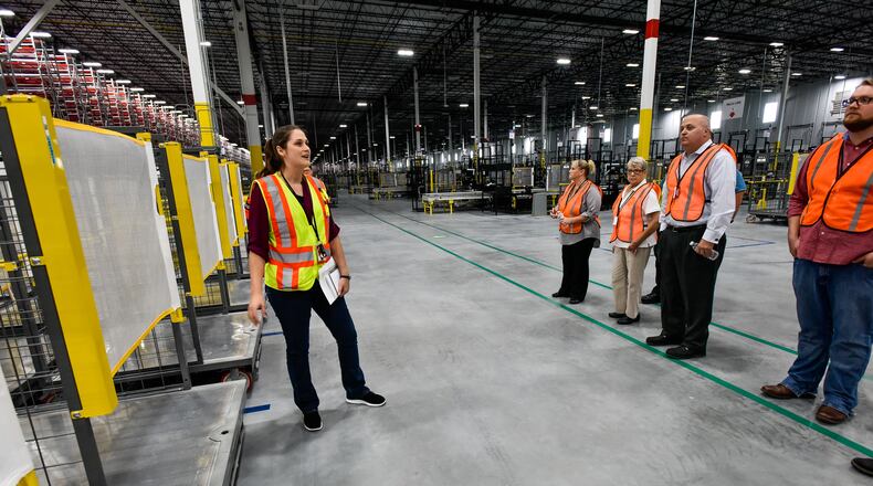 Employees at the Amazon Fulfillment Center in Monroe will make at least $15 per hour. NICK GRAHAM/STAFF