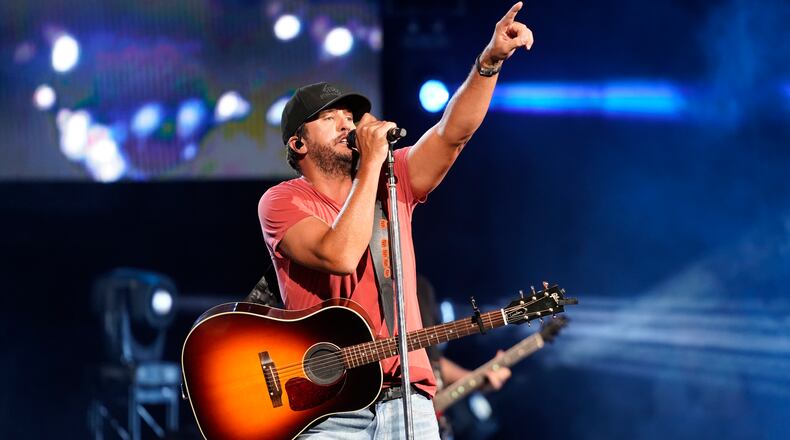 Luke Bryan performs on the Proud To Be Right Here 2021 tour at the Hollywood Casino Amphitheatre on Saturday, Aug. 21, 2021, in Tinley Park, Ill. (Photo by Rob Grabowski/Invision/AP)