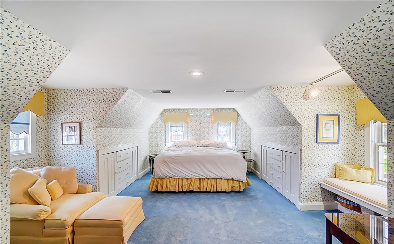 The primary bedroom suite has built in cabinets and drawers, slanted ceilings and dormer nooks as well as an ensuite bathroom.