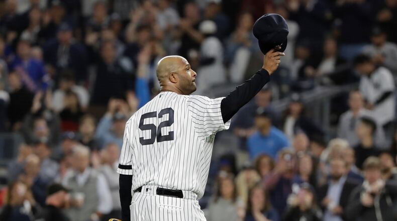 FILE - New York Yankees starting pitcher CC Sabathia gestures to fans as he leaves during the third inning of the team's baseball game against the Los Angeles Angels Sept. 18, 2019, in New York. (AP Photo/Frank Franklin II, File)
