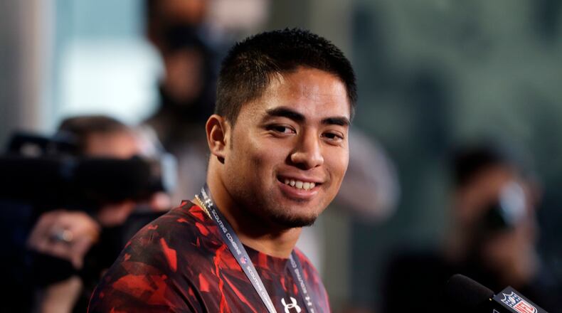Notre Dame linebacker Manti Te'o answers a question during a news conference at the NFL football scouting combine in Indianapolis, Saturday, Feb. 23, 2013. (AP Photo/Michael Conroy)