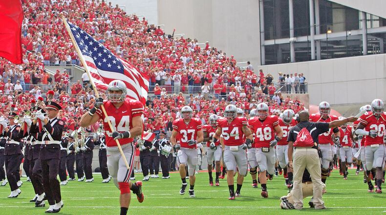 Ohio State Buckeyes defensive back Nate Ebner (34) leads the Ohio State Buckeyes onto the field prior to the game between Toledo and Ohio State at Ohio Stadium, Columbus, Ohio. Ohio State defeated Toledo 27-22.
