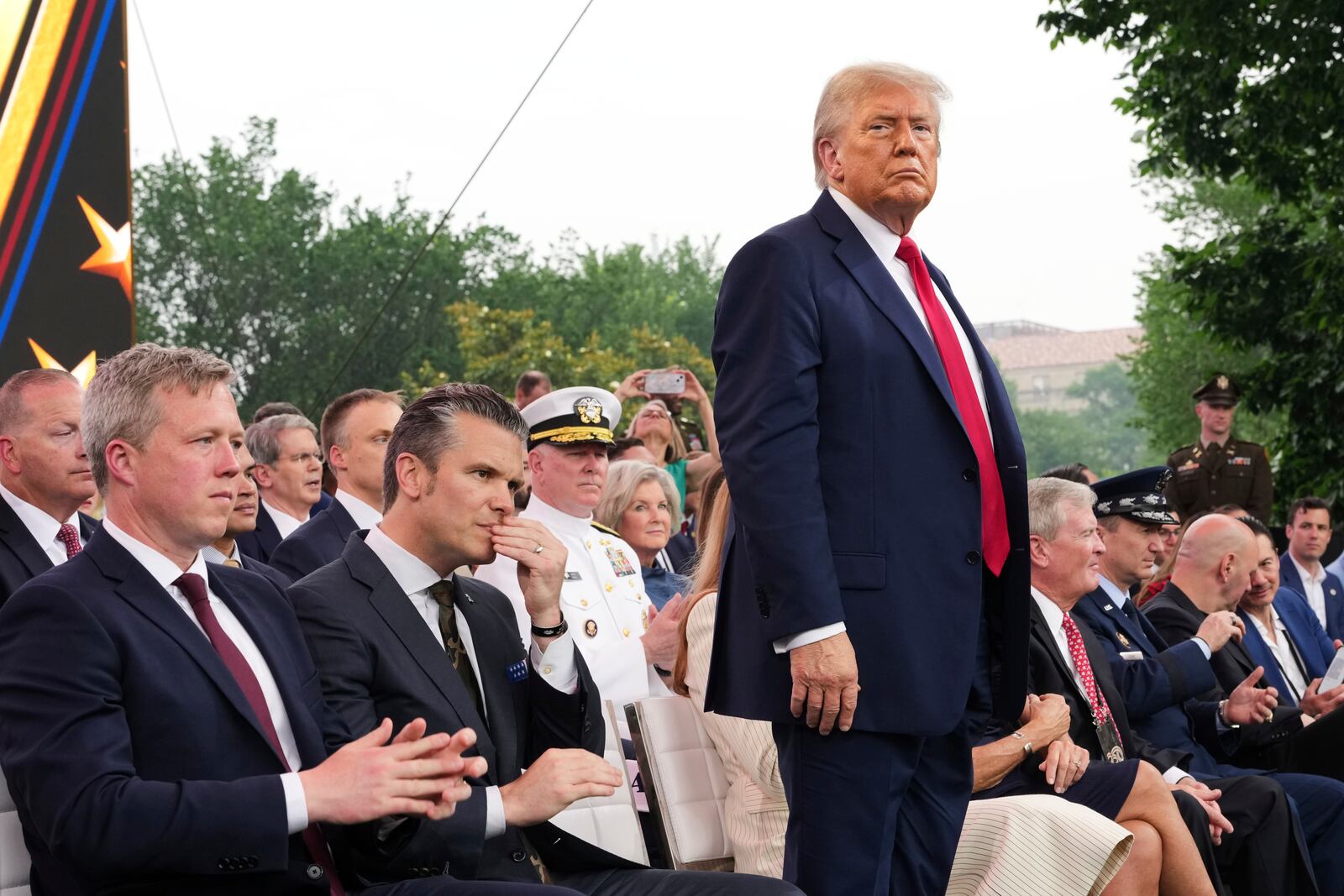 President Donald Trump looks on from the stage during a parade to honor the Army's 250th anniversary, coinciding with Trump's 79th birthday, Saturday, June 14, 2025, in Washington. (Doug Mills/The New York Times via AP, Pool)