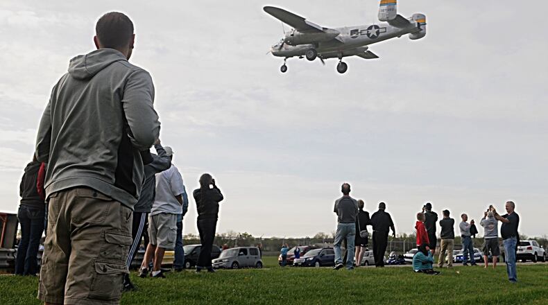Thousands of people swarmed onto the airstrip at the National Museum of the U.S. Air Force on Monday as 11 World War II era B-25s landed to mark the 75th anniversary of the historic Doolittle Raiders attack against Japan. MARSHALL GORBY/STAFF