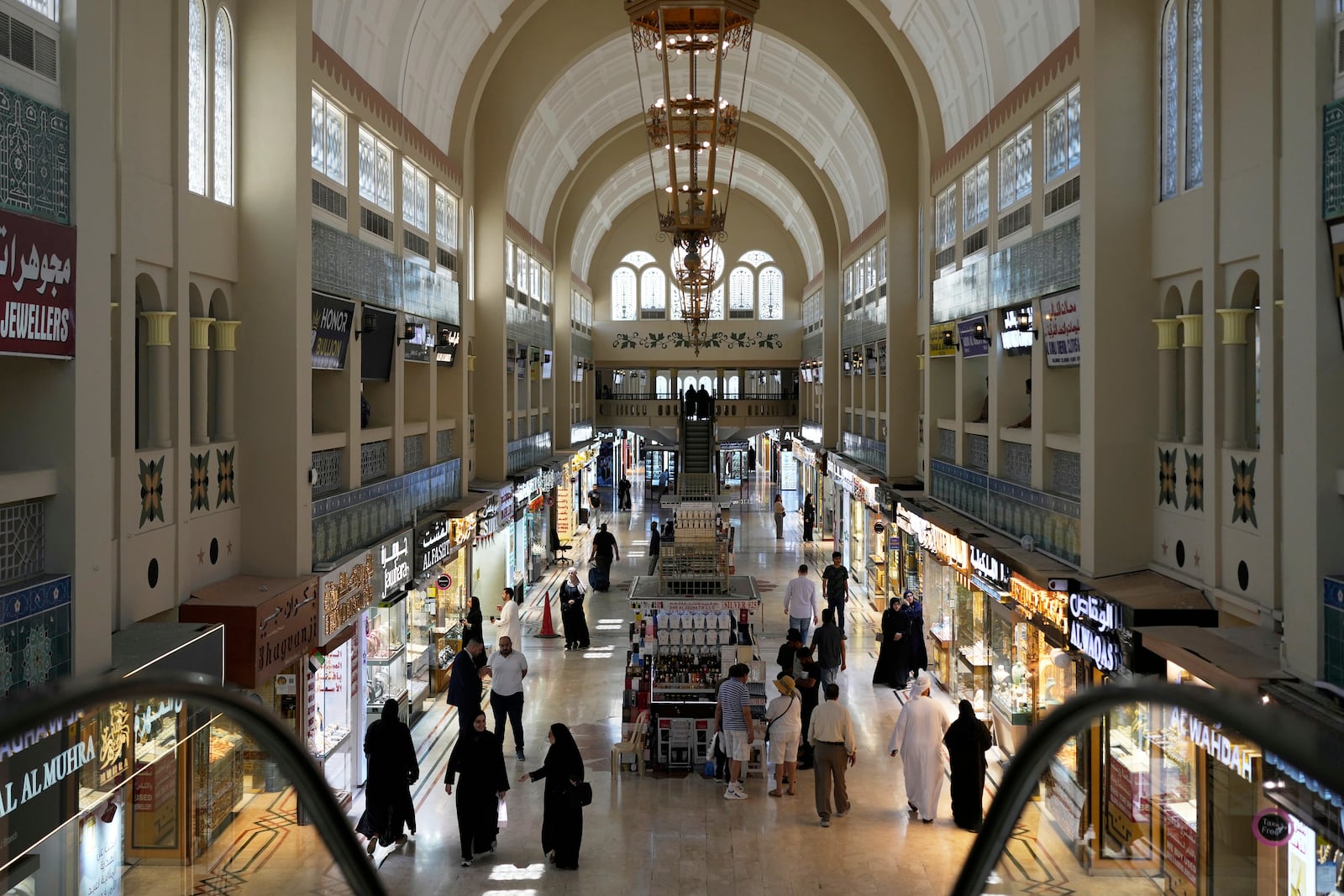 FILE - People shop for gold at a jewelry market in Dubai, United Arab Emirates, Wednesday, April 9, 2025. (AP Photo/Altaf Qadri, File)