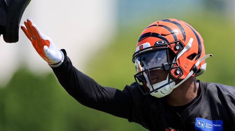Cincinnati Bengals' Cam Taylor-Britt participates in a drill during a practice at the NFL football team's training facility in Cincinnati, Monday, Aug. 1, 2022. (AP Photo/Aaron Doster)