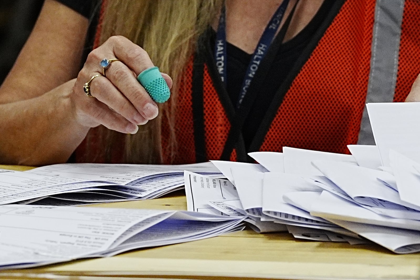 Votes are counted at DCBL Halton Stadium, in Widnes, Cheshire, England, for the Runcorn and Helsby by-election that was triggered by the resignation of former Labour MP Mike Amesbury, Thursday, May 1, 2025. (Peter Byrne/PA via AP)