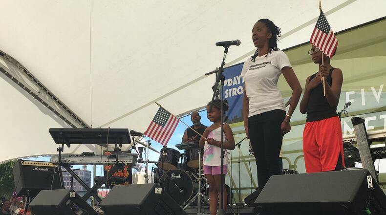 Felita LaRock, former singer with the Air Force Band of Flight, sang the Star Spangled Banner to kick off the Dayton Strong Benefit Concert at Riverscape MetroPark Saturday July 13, 2019. RICHARD WILSON/STAFF