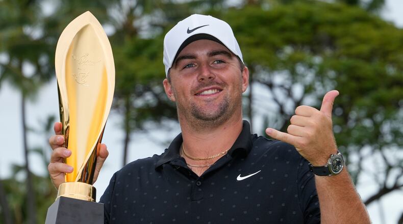 Chris Gotterup holds his trophy after winning the Sony Open golf event at the Waialae Country Club in Honolulu, Sunday, Jan. 18, 2026. (AP Photo/Matt York)