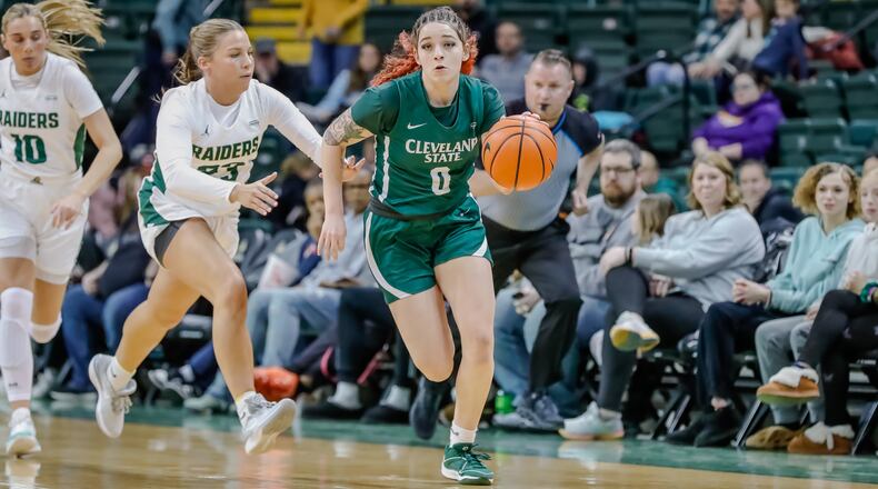 Cleveland State University's Mickayla Perdue, a Springfield High School graduate, is chased by Wright State University's Macie Taylor during their game on Wednesday, Jan. 17. Michael Cooper/CONTRIBUTED