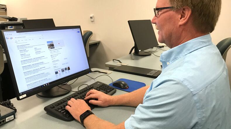Dan Heighton with Clark State Community College looks at the Clark County Board of Elections website. The Clark County Board of Elections and Clark State Community College will work together to assess the Boards technology equipment, procedures and policies before the upcoming elections. JEFF GUERINI/STAFF