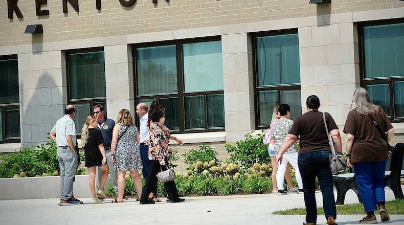 Community members are shown outside the new Kenton Ridge school as officials conducted a ribbon-cutting and building dedication ceremony Saturday, Aug. 19, 2023. The new school will house all Kenton Ridge students. MARSHALL GORBY\STAFF