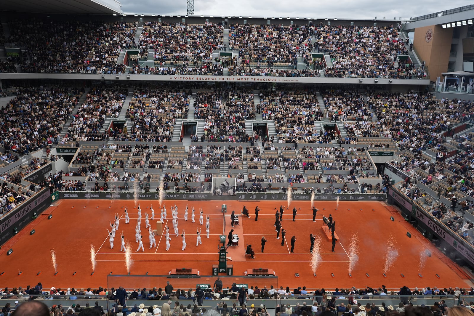 Dane group performs before the final match of the French Tennis Open at the Roland-Garros in Paris, Saturday, June 7, 2025. (AP Photo/Lindsey Wasson)