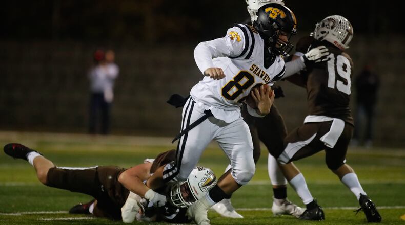 Shawnee High School senior Evan Thomas (88) runs the ball during their game against Roger Bacon on Saturday Night in St. Bernard. The Spartans won 31-7. Michael Cooper/CONTRIBUTED