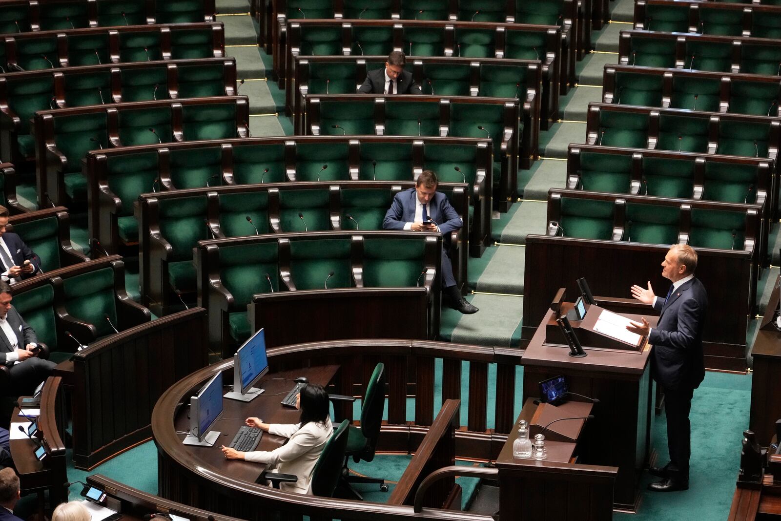 Poland's Prime Minister Donald Tusk addresses the Polish parliament on Wednesday, June 11, 2025, in Warsaw, Poland. (AP Photo/Czarek Sokolowski)