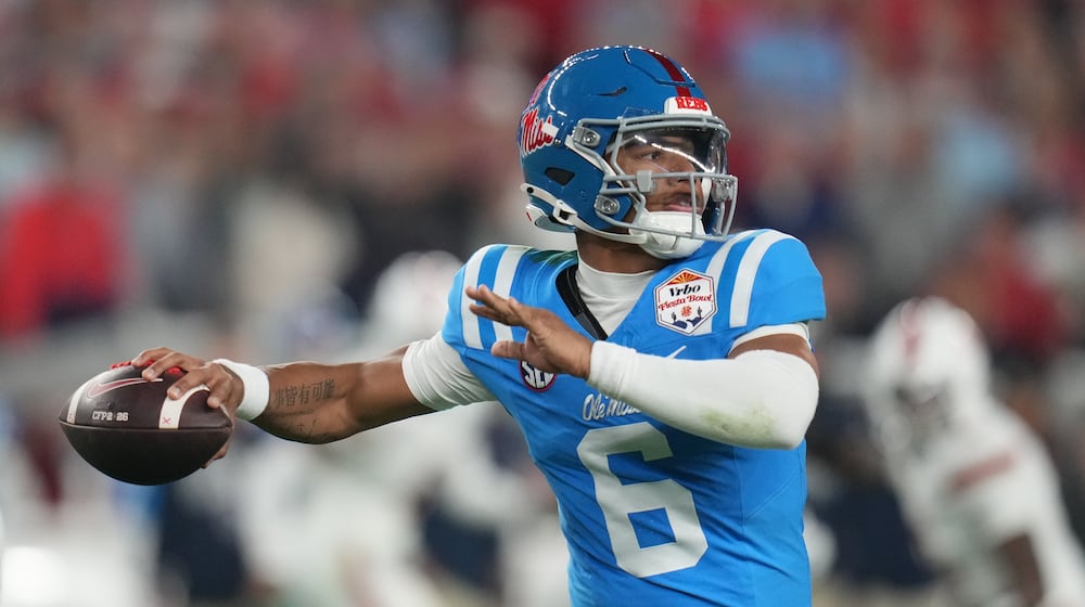 FILE - Mississippi quarterback Trinidad Chambliss throws during the first half of the Fiesta Bowl NCAA college football playoff semifinal game against Miami, Jan. 8, 2026, in Glendale, Ariz. (AP Photo/Rick Scuteri, File)