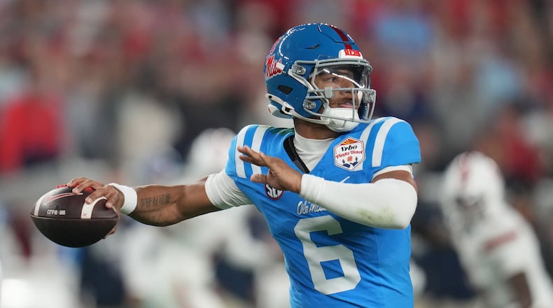 FILE - Mississippi quarterback Trinidad Chambliss throws during the first half of the Fiesta Bowl NCAA college football playoff semifinal game against Miami, Jan. 8, 2026, in Glendale, Ariz. (AP Photo/Rick Scuteri, File)