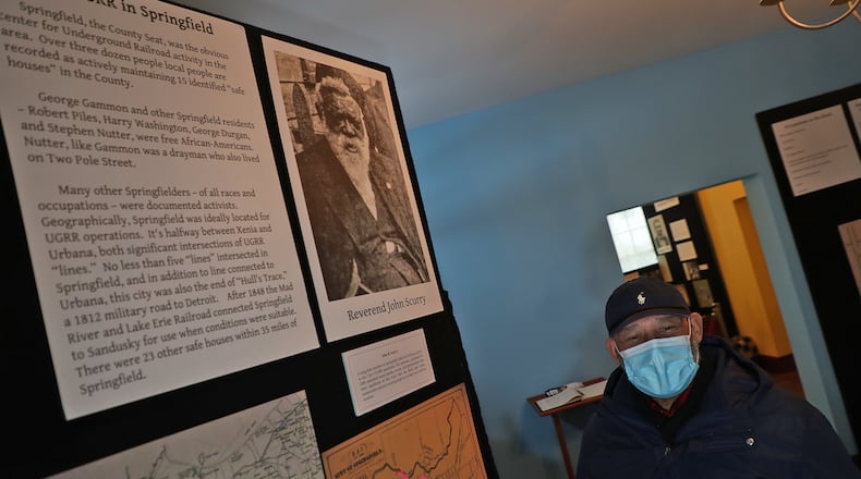 Dale Henry, president of the Gammon House, talks about Revered John Scurry during a recent visit to the Gammon House. BILL LACKEY/STAFF