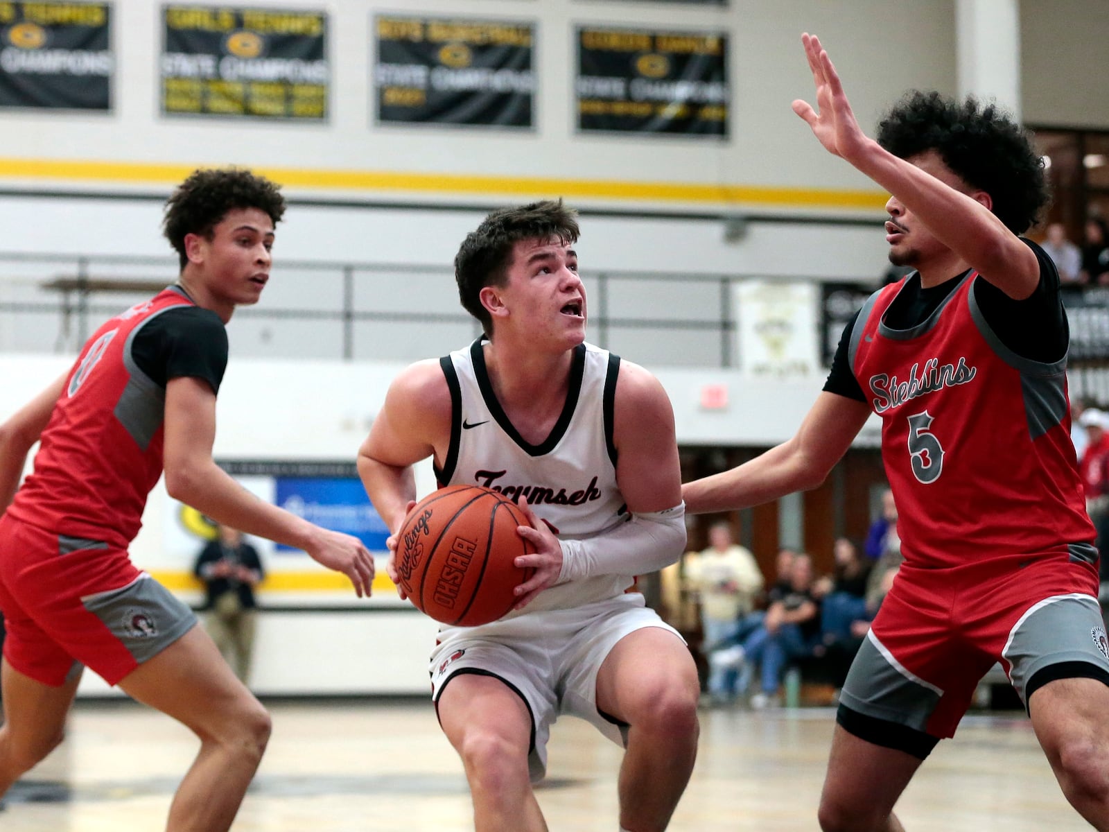 Tecumseh senior Chase Stafford tries to find a way to get a shot up under the basket. Tecumseh defeated Stebbins 55-47 in a Division III district semifinal game on Wednesday, March 4, 2026, in Centerville. STEVEN WRIGHT / STAFF