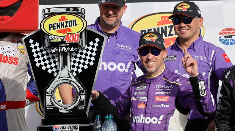 Denny Hamlin poses with his trophy in Victory Lane after winning a NASCAR Cup Series auto race at, Sunday, March 15, 2026, in Las Vegas. (AP Photo/Steve Marcus)