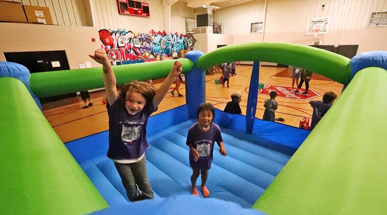 Children bounce around in a bouncy house a few years ago during the Springfield Salvation Army's last day of the Summer Day Camp program for children with disabilities in 2021. BILL LACKEY/STAFF