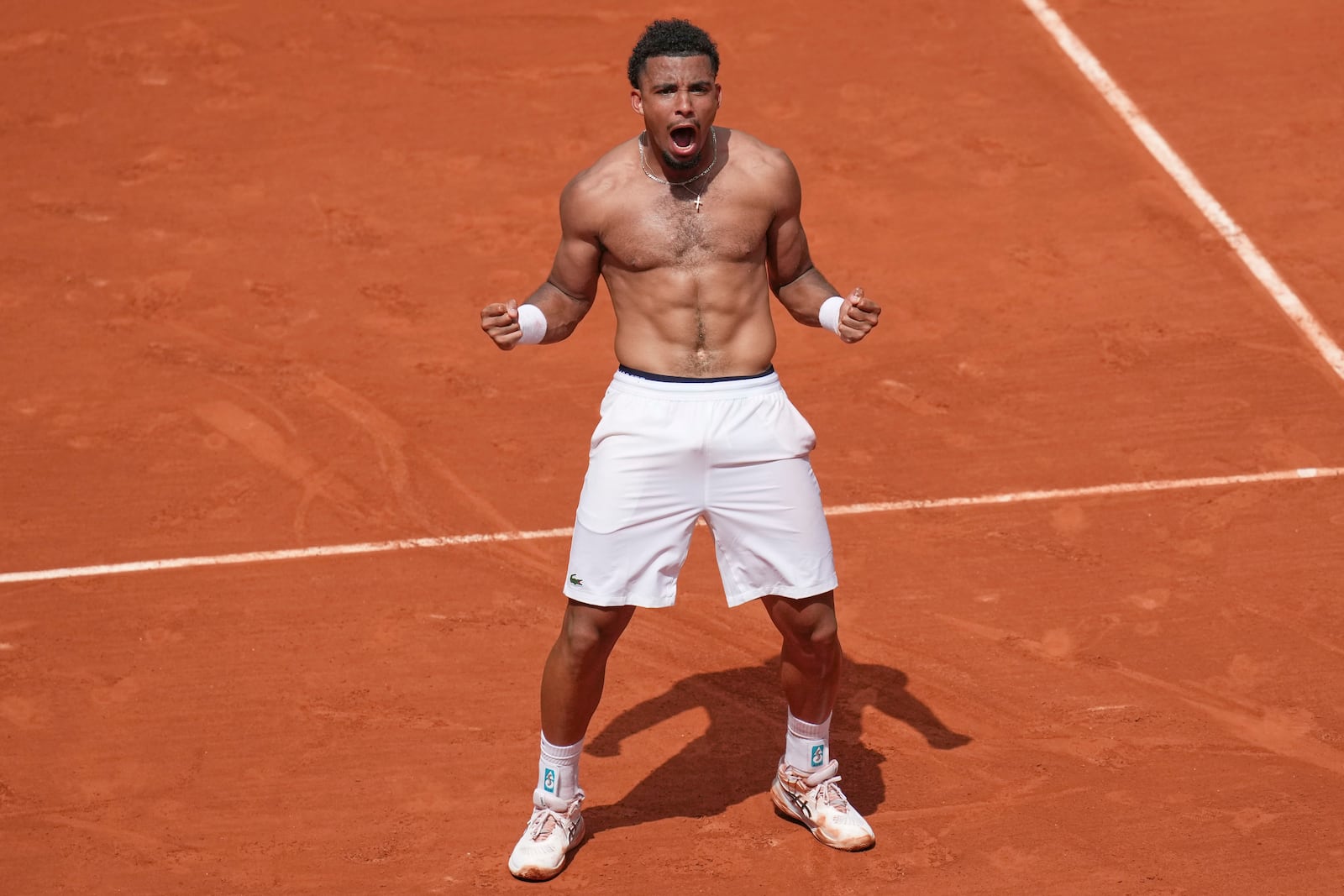 France's Arthur Fils celebrates beating Spain's Jaume Munar after their second round match of the French Tennis Open, at the Roland-Garros stadium, in Paris, Thursday, May 29, 2025. (AP Photo/Christophe Ena)