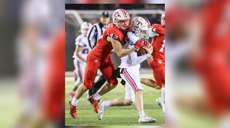 Tippecanoe junior linebacker Raiden Nicholls tackles Talawanda's Jake Van Gorden during a Division III, Region 12 quarterfinal on Friday, Nov. 7 at Tipp City Park. BRYANT BILLING/STAFF
