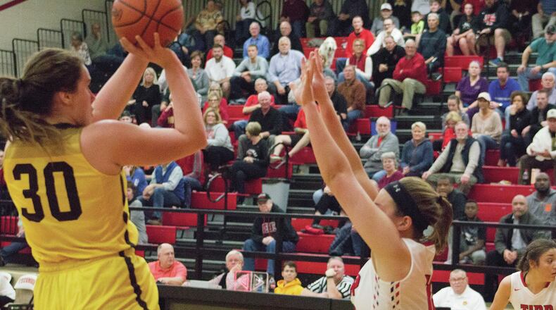Kenton Ridge’s Mikala Morris shoots over Tippecanoe’s Hailee Varvel on Tuesday night at Tecumseh. Morris scored 12 points in a 48-43 loss to Tipp. Jeff Gilbert/CONTRIBUTED