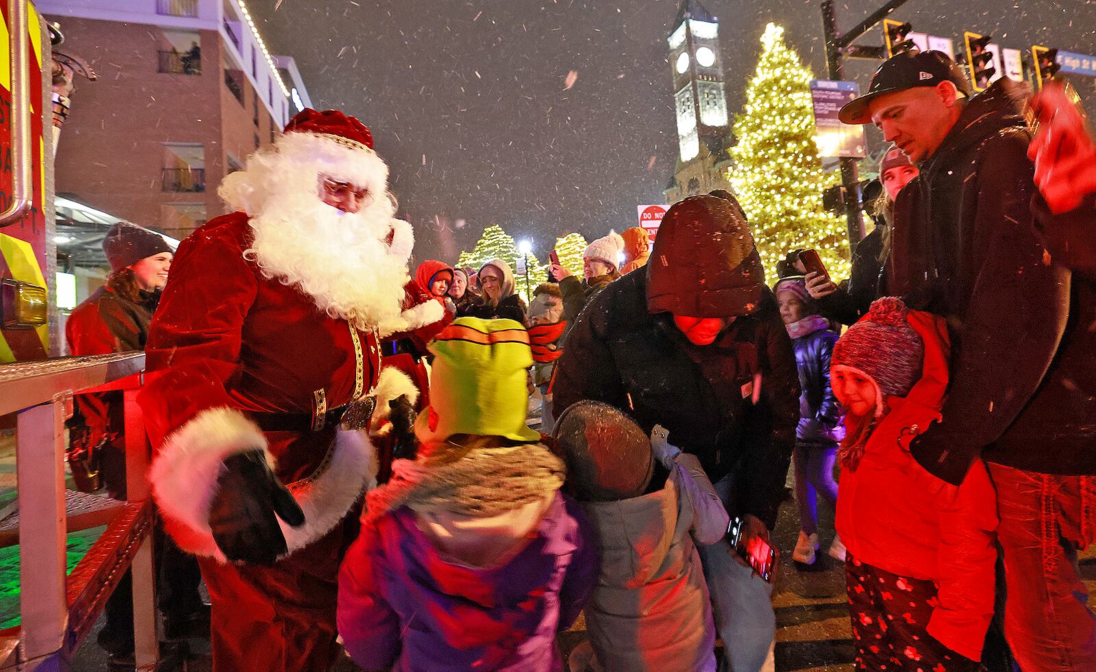 Santa greets children after lighting the Springfield Holiday Tree with help from the Springfield Fire Division Friday, Nov. 29, 2024 during the Holiday in the City Grand Illumination. BILL LACKEY/STAFF
