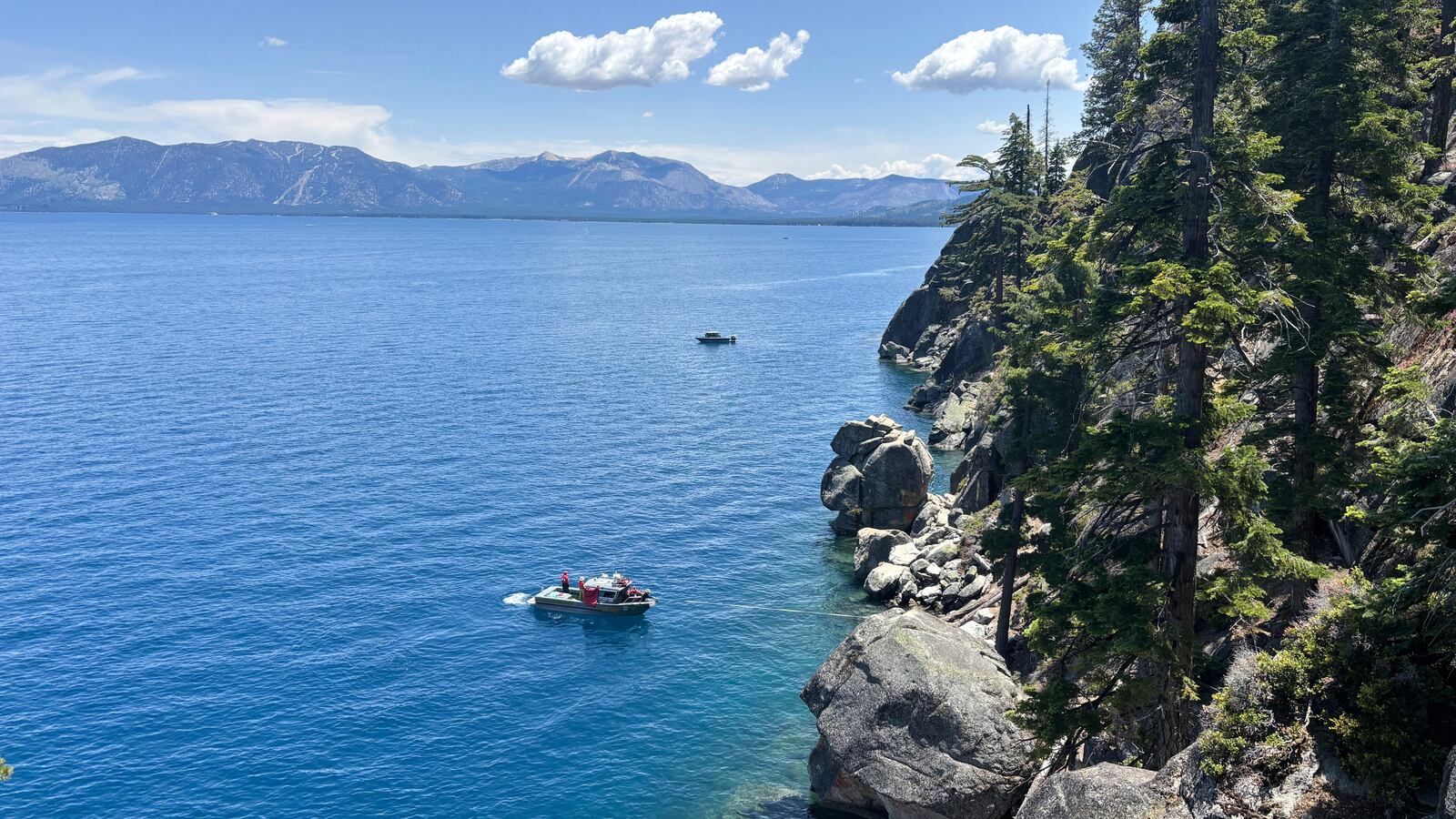 Authorities conduct searches along the shore at D.L. Bliss State Park after a weekend incident in which a boat capsized, killing several people, on Monday, June 23, 2025, in South Lake Tahoe, Calif. (AP Photo/Brooke Hess-Homeier)