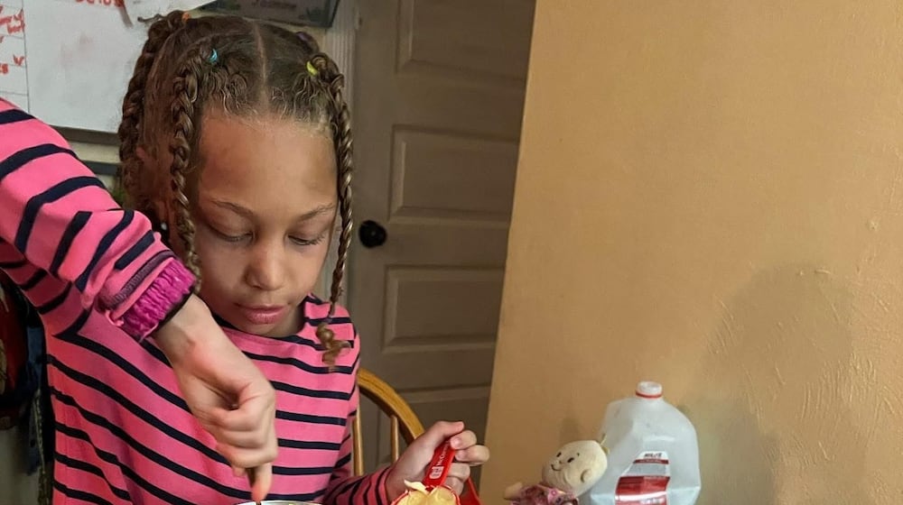 Jasmine, Pamela’s daughter, makes Christmas cookies, one of their favorite traditions. CONTRIBUTED