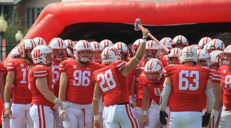 Wittenberg players prepare to run onto the field before a game against SUNY Cortland on Saturday, Sept. 4, 2021, at Edwards-Maurer Field in Springfield. David Jablonski/Staff