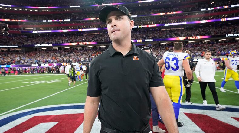Cincinnati Bengals head coach Zac Taylor walks off the field after the Bengals were defeated by the Los Angeles Rams in the NFL Super Bowl 56 football game Sunday, Feb. 13, 2022, in Inglewood, Calif. (AP Photo/Lynne Sladky)