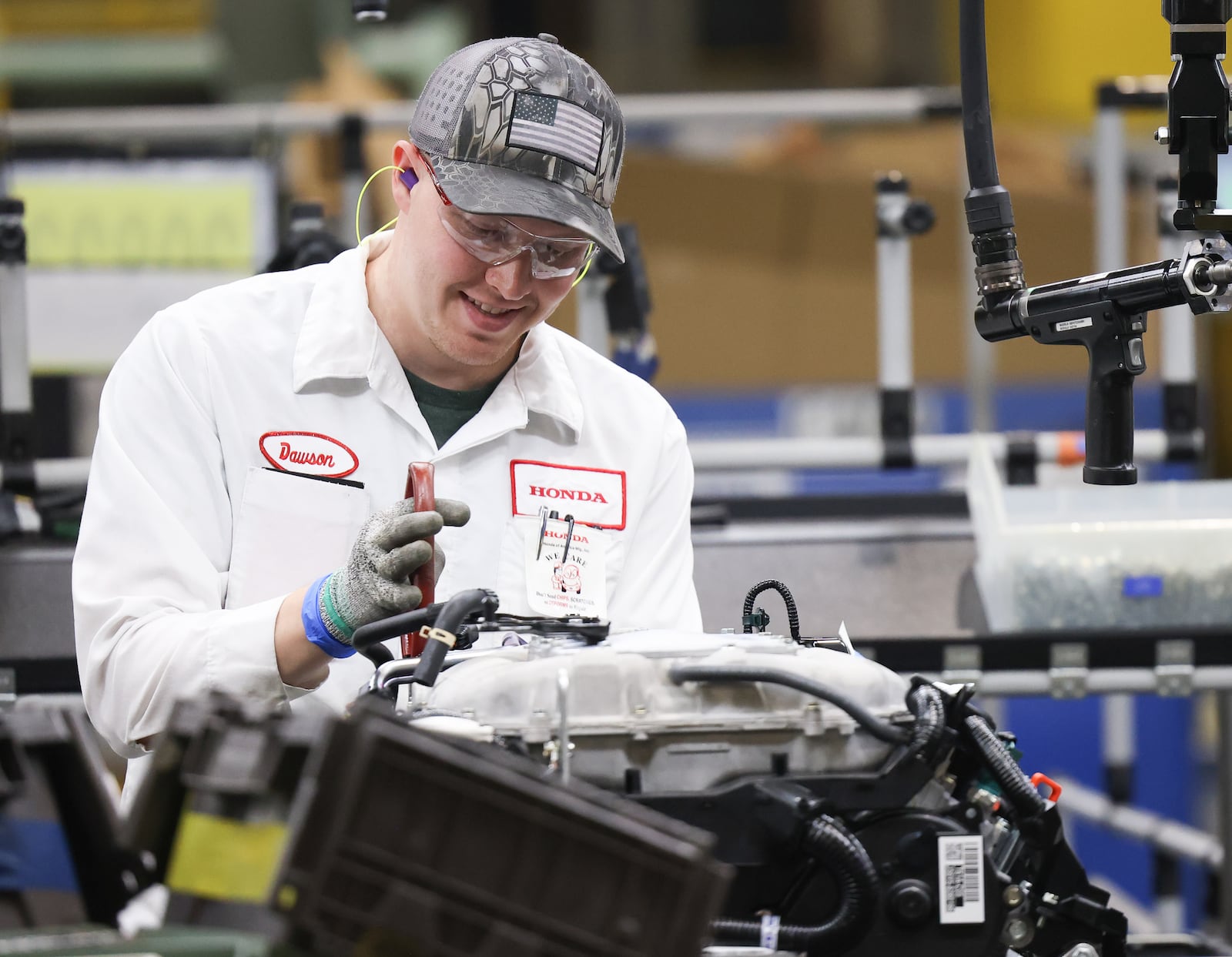 An associate works on an engine on the assembly line at Honda's Anna Engine Plant on Tuesday, July 15. The plant is celebrating its 40th anniversary. BRYANT BILLING / STAFF