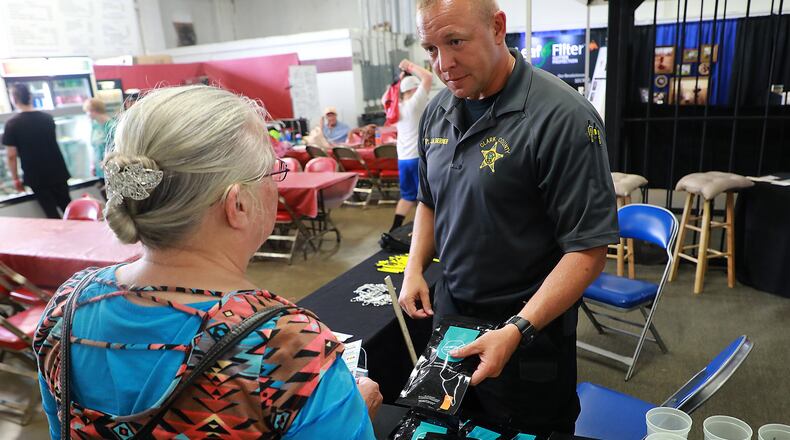 Deputy Josh Berner passes out Deterra Drug Deactivation Kits to people at the Clark County Fair. BILL LACKEY/STAFF