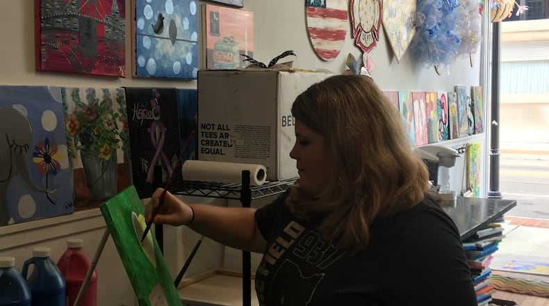Several events will be held this weekend in Clark and Champaign counties, including a "Galentine's craft room" event held by Sip & Dipity at the Warder Literacy Center in Springfield. Here, Tracey Tackett, owner of Sip and Dipity Paint Bar in Springfield, worked on artwork at her business on Fountain Avenue. STAFF