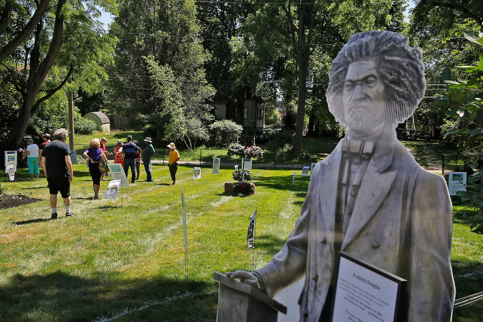 A lifesize cutout of Fredrick Douglas greets visitors at the end of the Discovery Walk through the Underground Railroad safe houses and secret codes along Route 68 from the Ohio River to Lake Erie behind the Gammon House Saturday, June 15, 2024 during the annual Juneteenth and Fatherfest Celebration. BILL LACKEY/STAFF