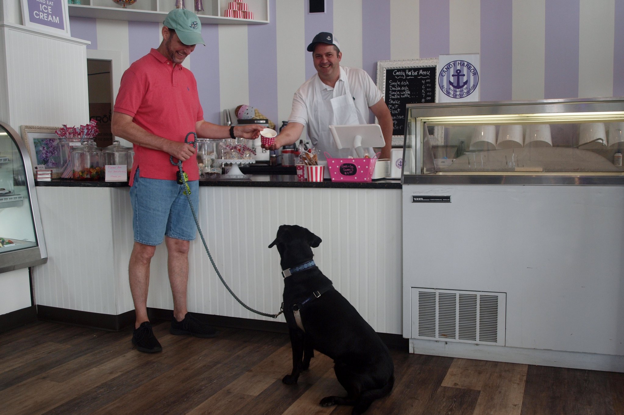 Teddy waiting patiently for his dad to get his ice cream from Erik Berakovich, the owner of Candy Harbor. KARIN SPICER